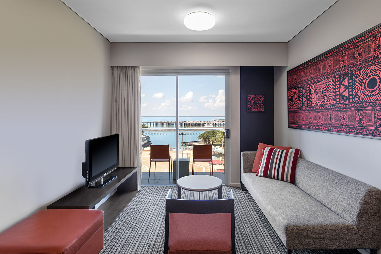 adina apartment hotel darwin waterfront one bedroom view room lounge room 01 2016