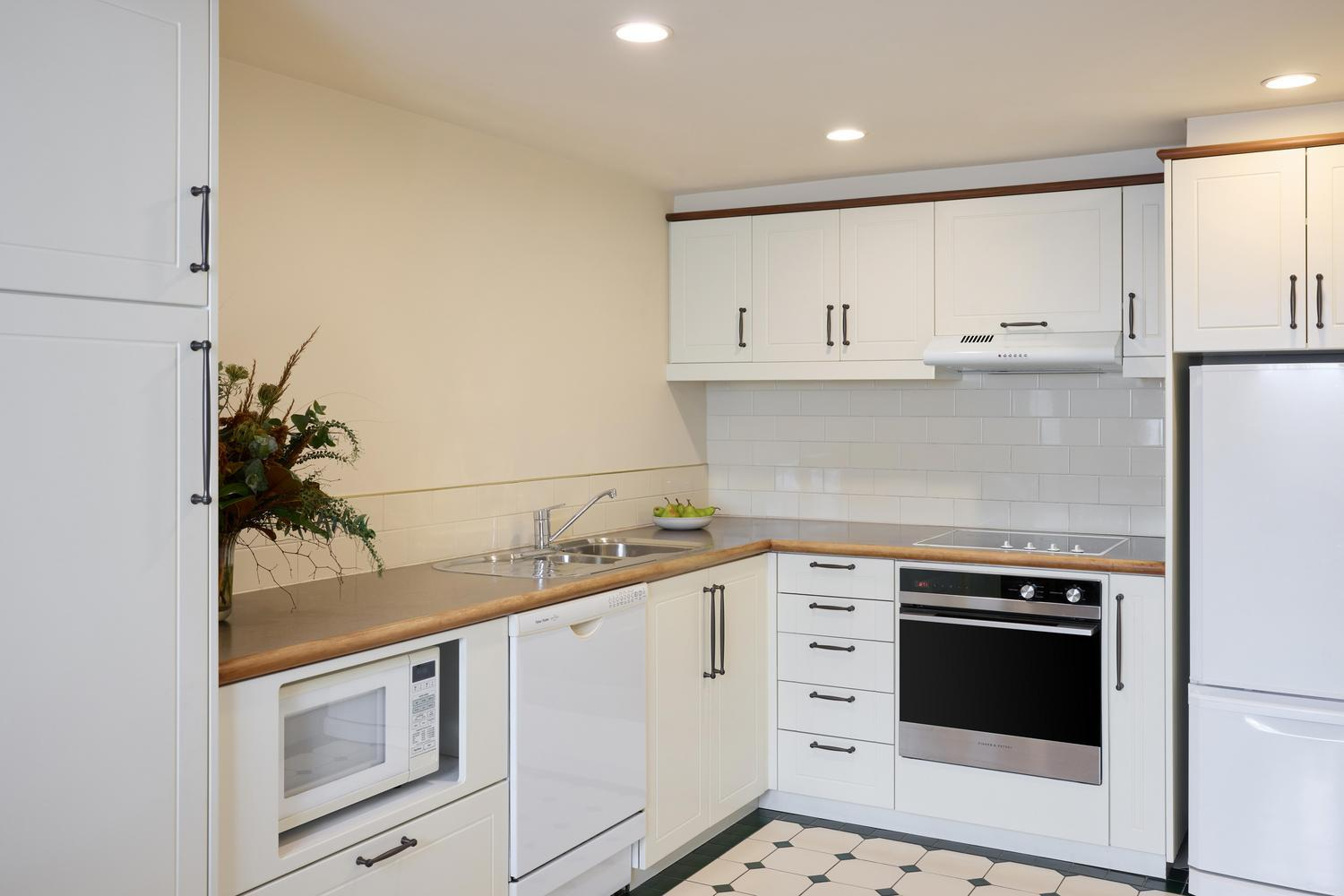 adina heritage christchurch 2 bedroom family apartment kitchen styled_2026 1
