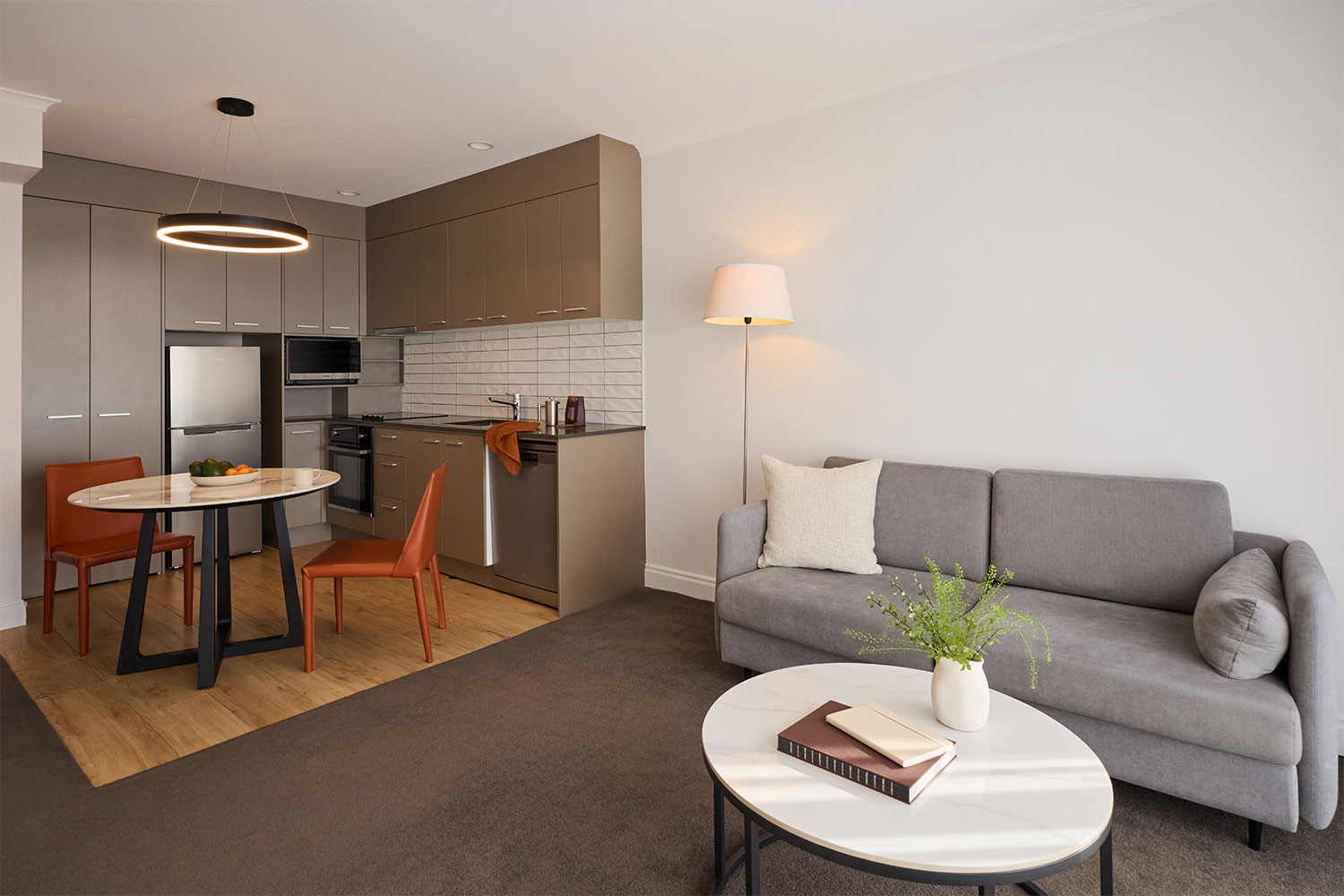 adina citylife auckland 1 bed apartment living room styled 2026 1